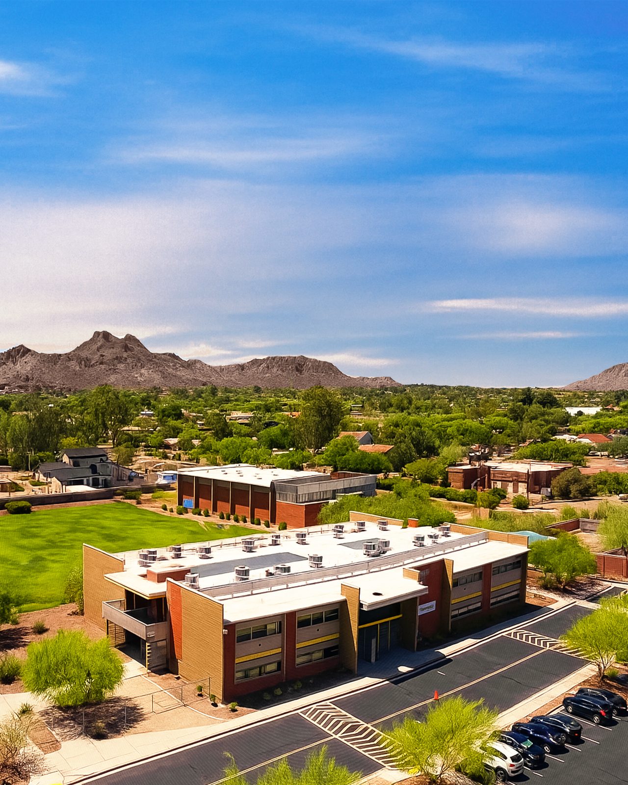 Aerial view of the Gateway Academy campus with Phoenix mountains beyond